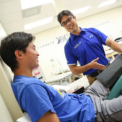 A students practices patient care in the athletic training lab